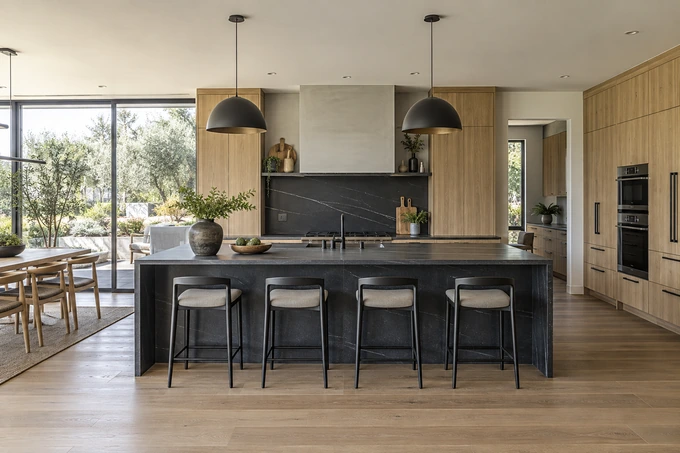 Realistic refined kitchen interior with charcoal island and light oak cabinets, unmistakably a complete coherent physical space