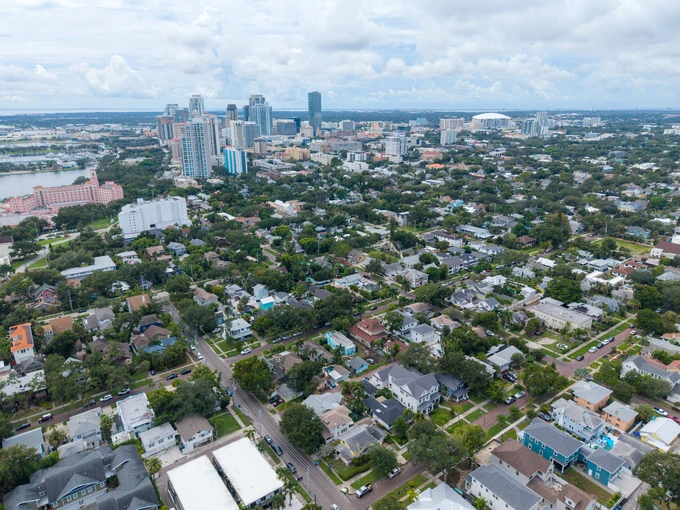Residential neighborhood with a city skyline in the distance