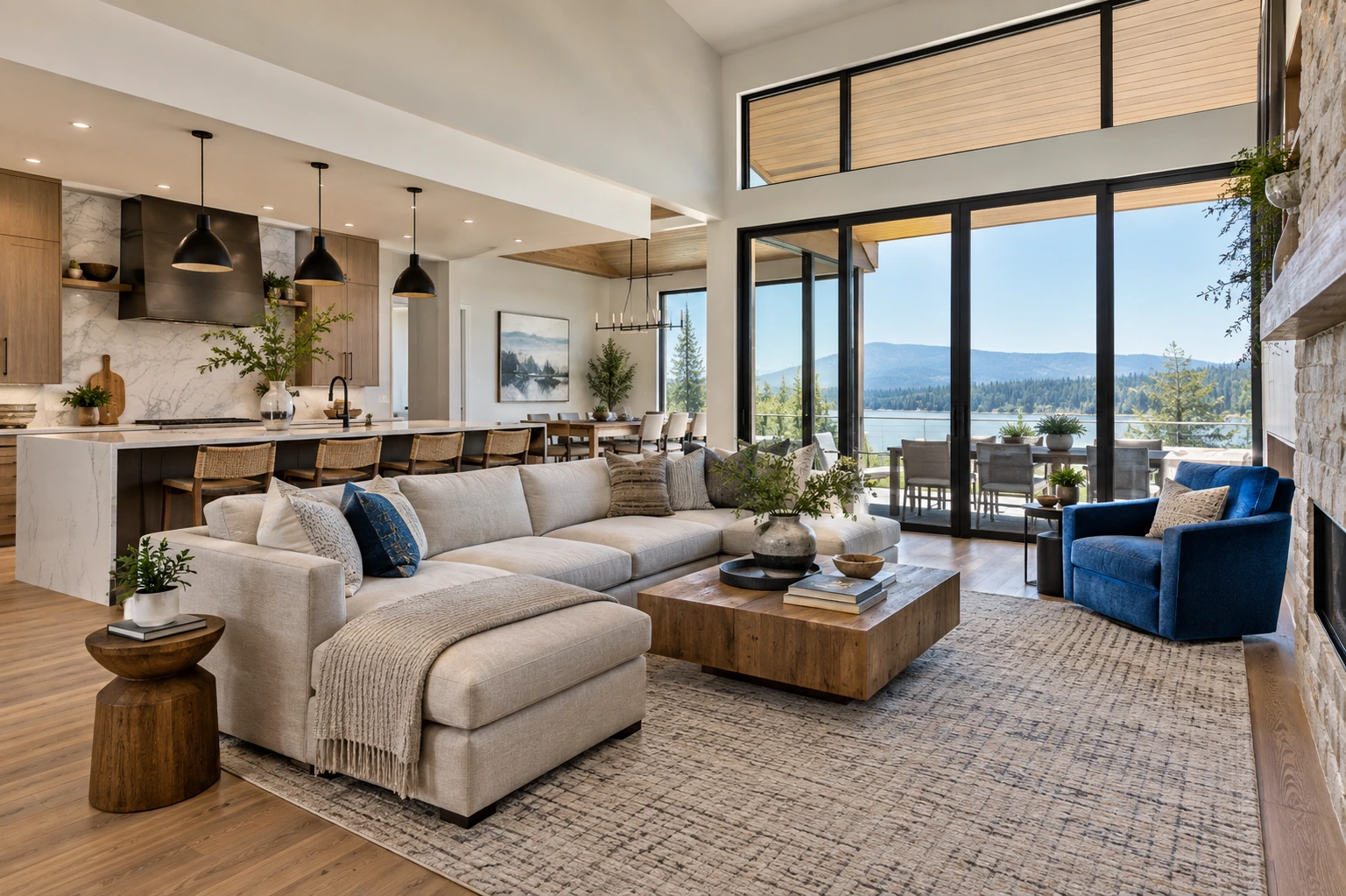 Visually clear open-concept lounge and kitchen with a coherent route and a vivid but tasteful blue accent chair